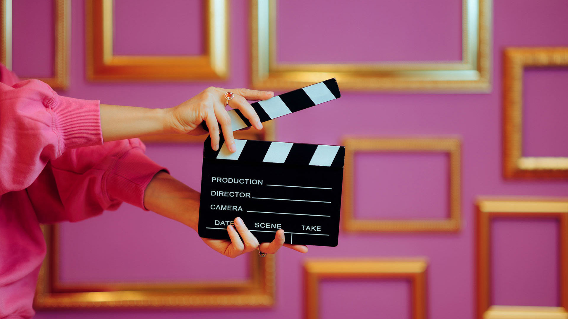 woman holding a clapper board
